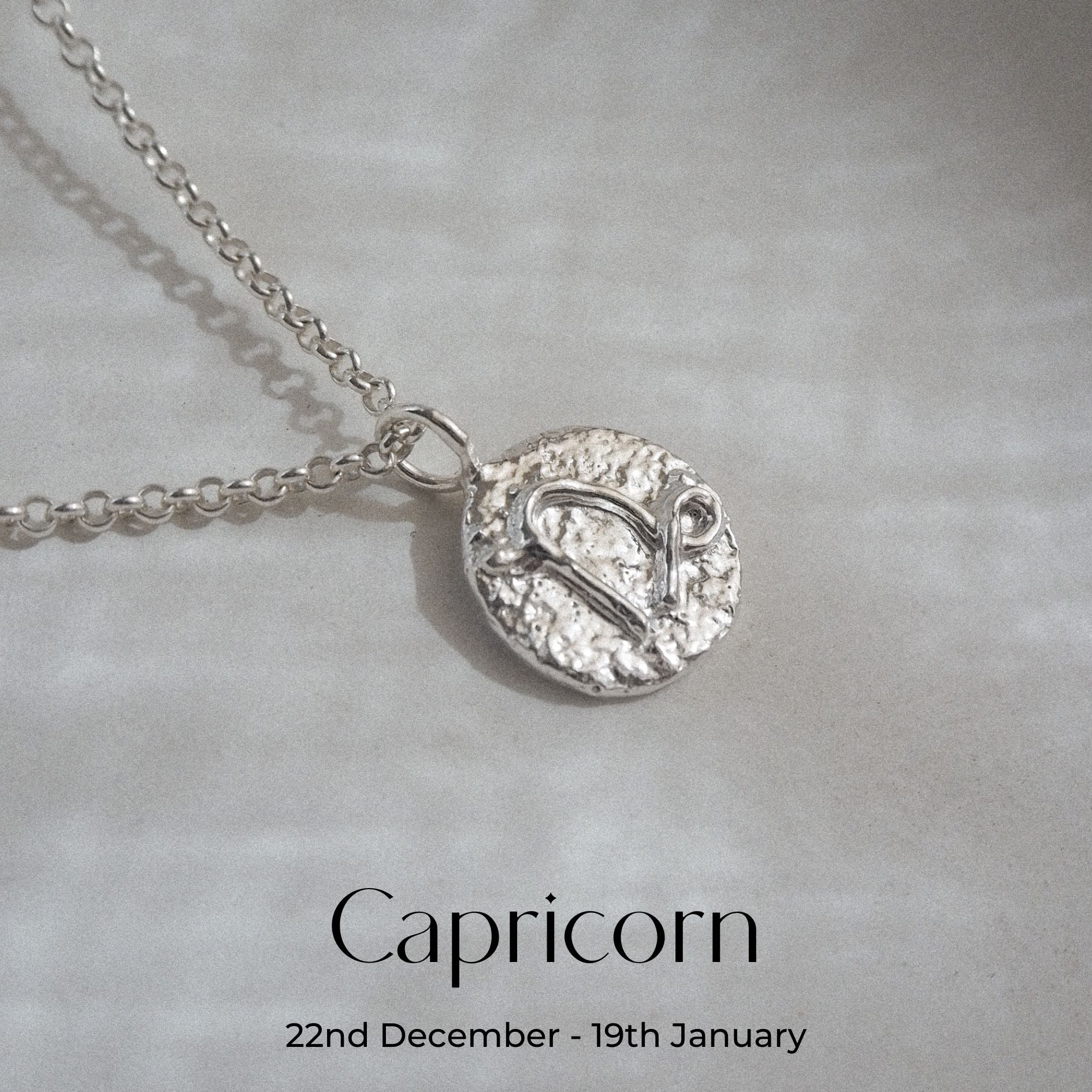 Hand-forged molten Capricorn Necklace in Sterling Silver on a belcher chain