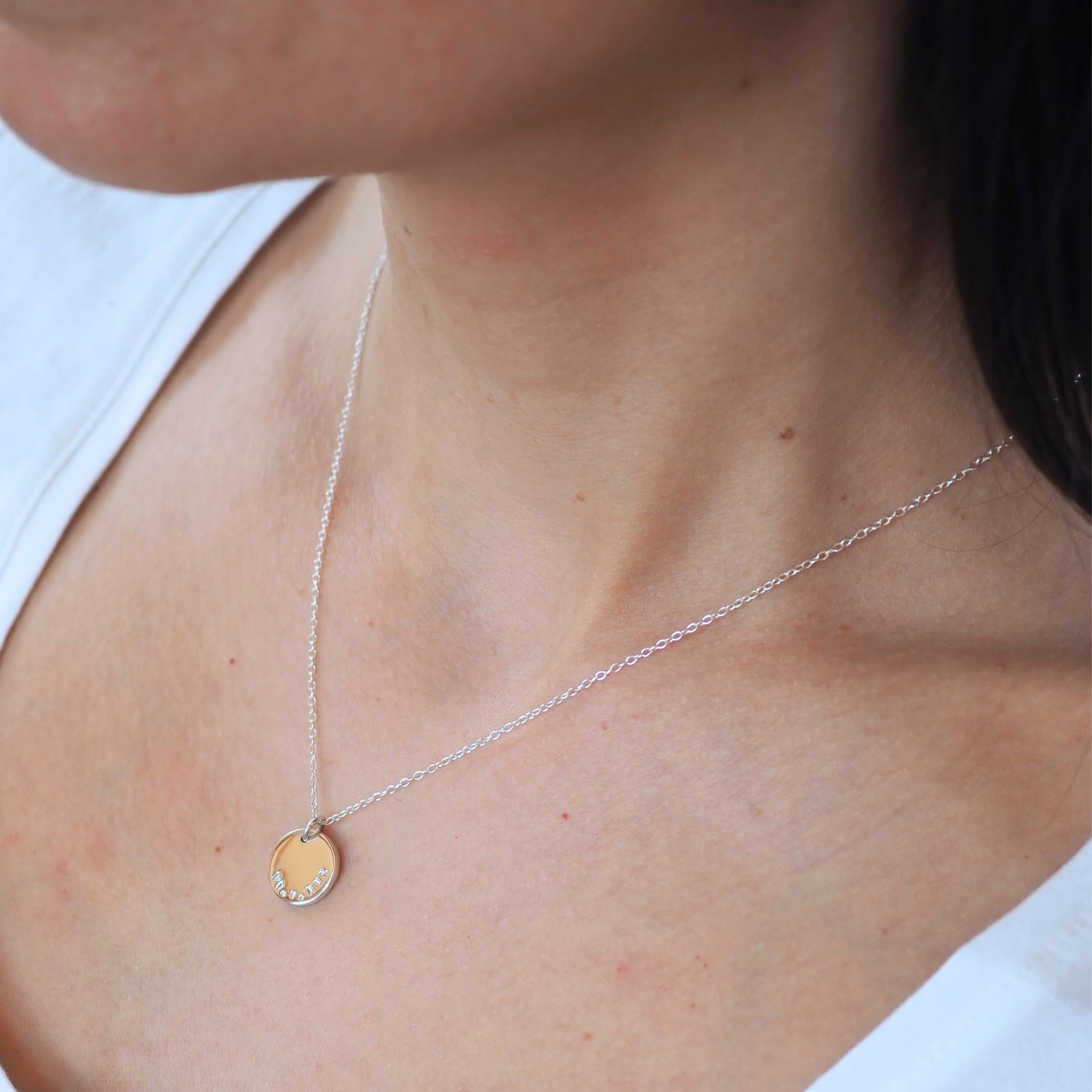Model wearing a personalised double sided disc necklace