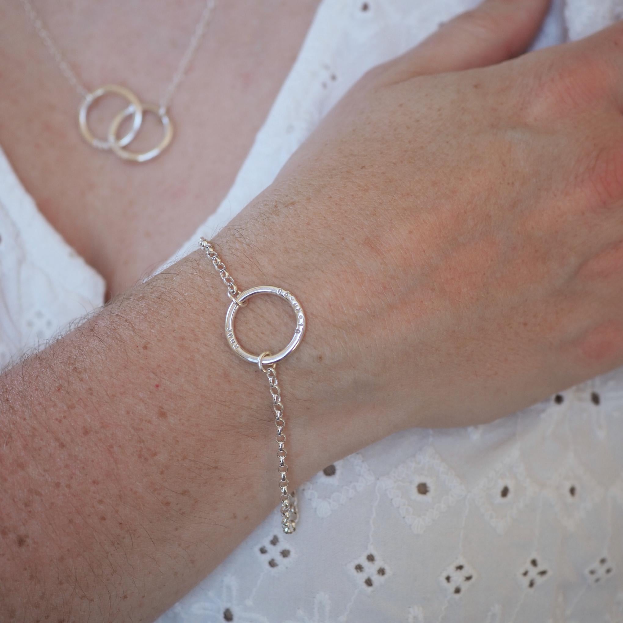 Woman wearing a personalised Halo Bracelet on her wrist.