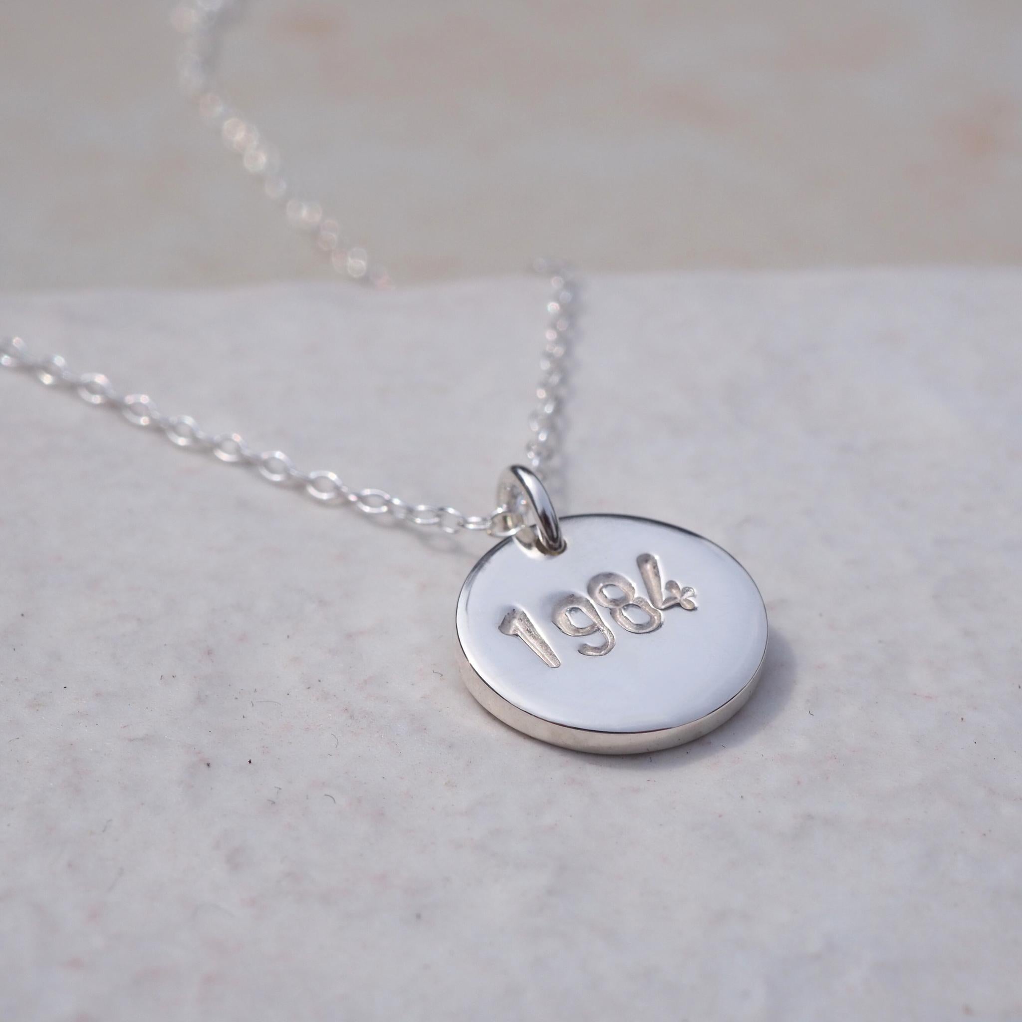 Hand-stamped year necklace in sterling silver, ideal for commemorating milestones
