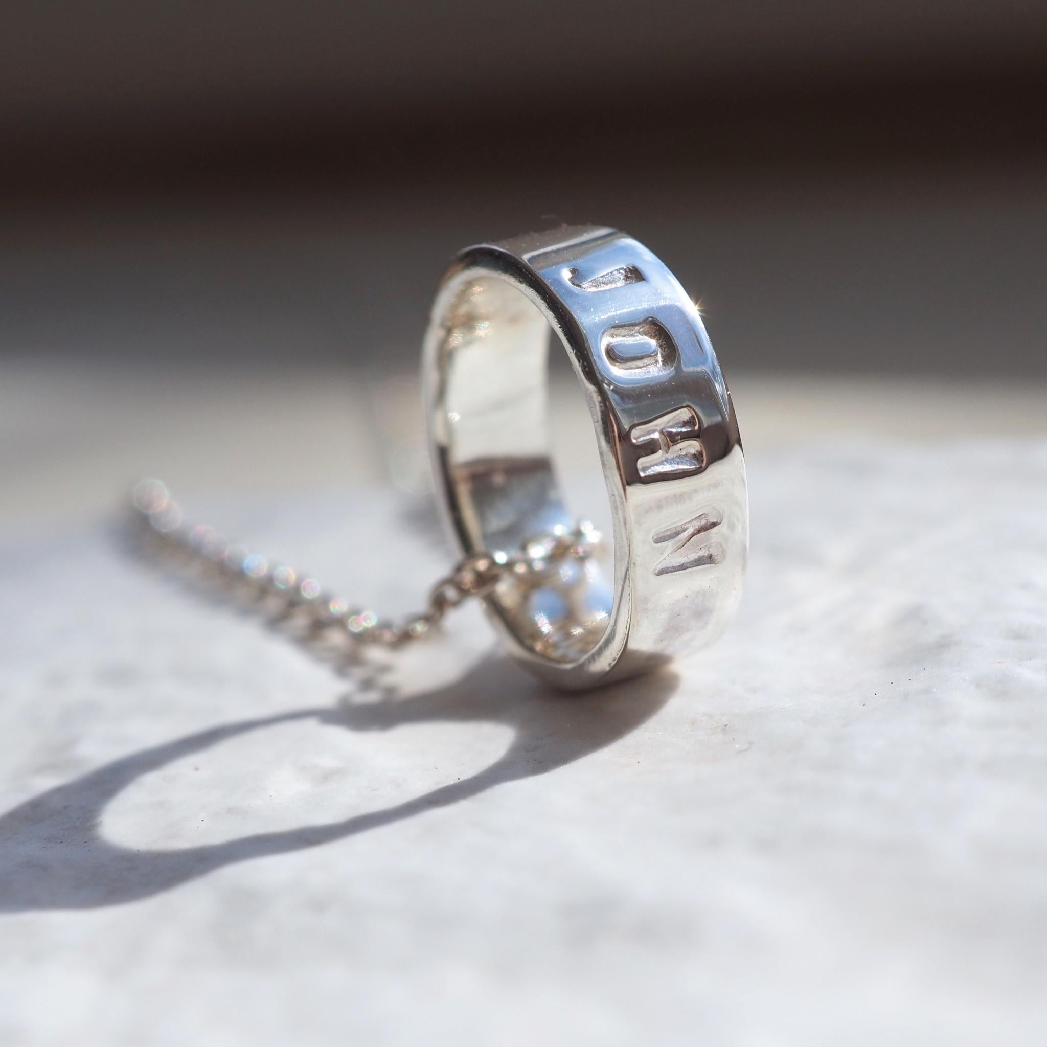 Sterling silver scroll necklace. Personalised with hand-stamped names, words or dates