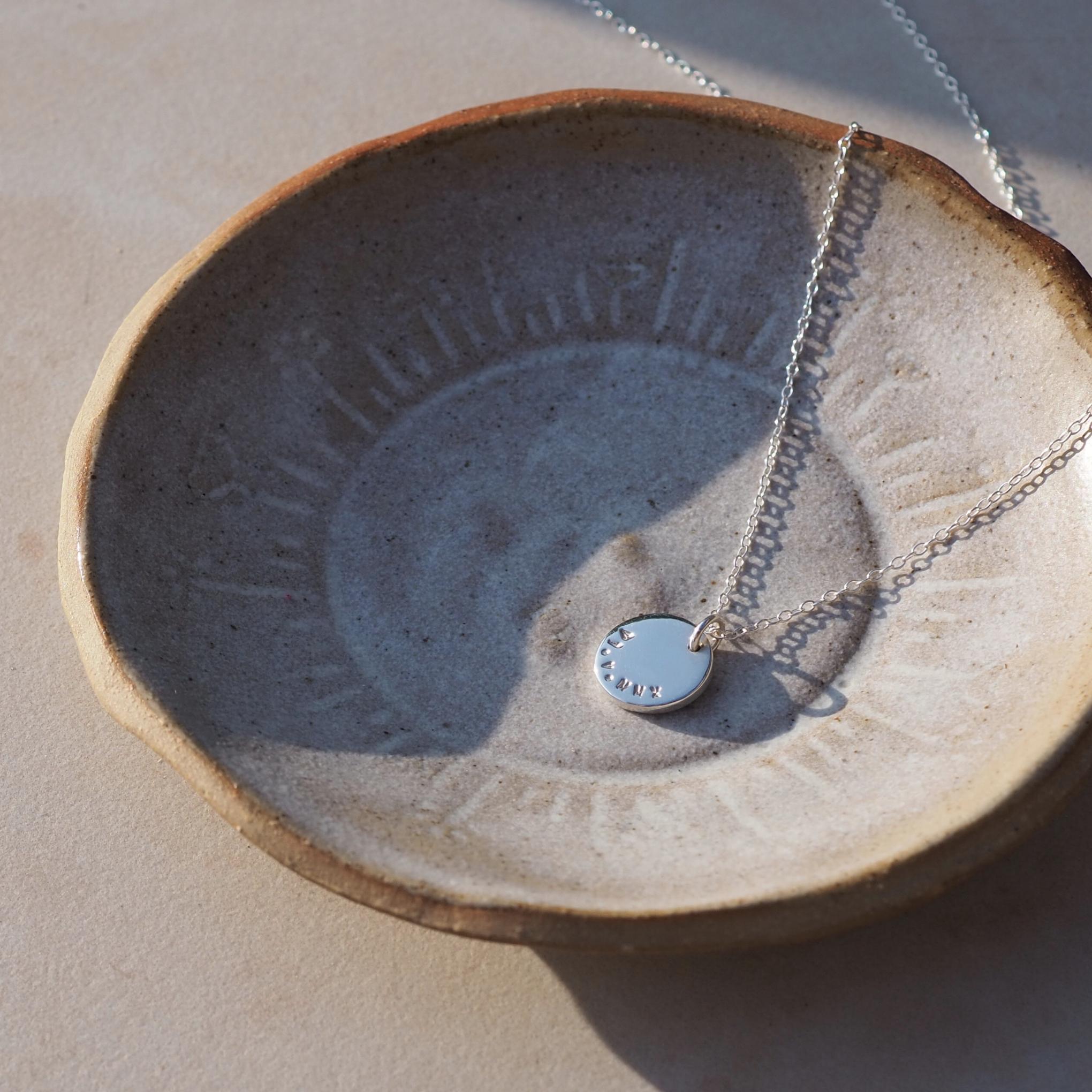 Double-sided disc necklace in sterling silver, personalised with on both sides