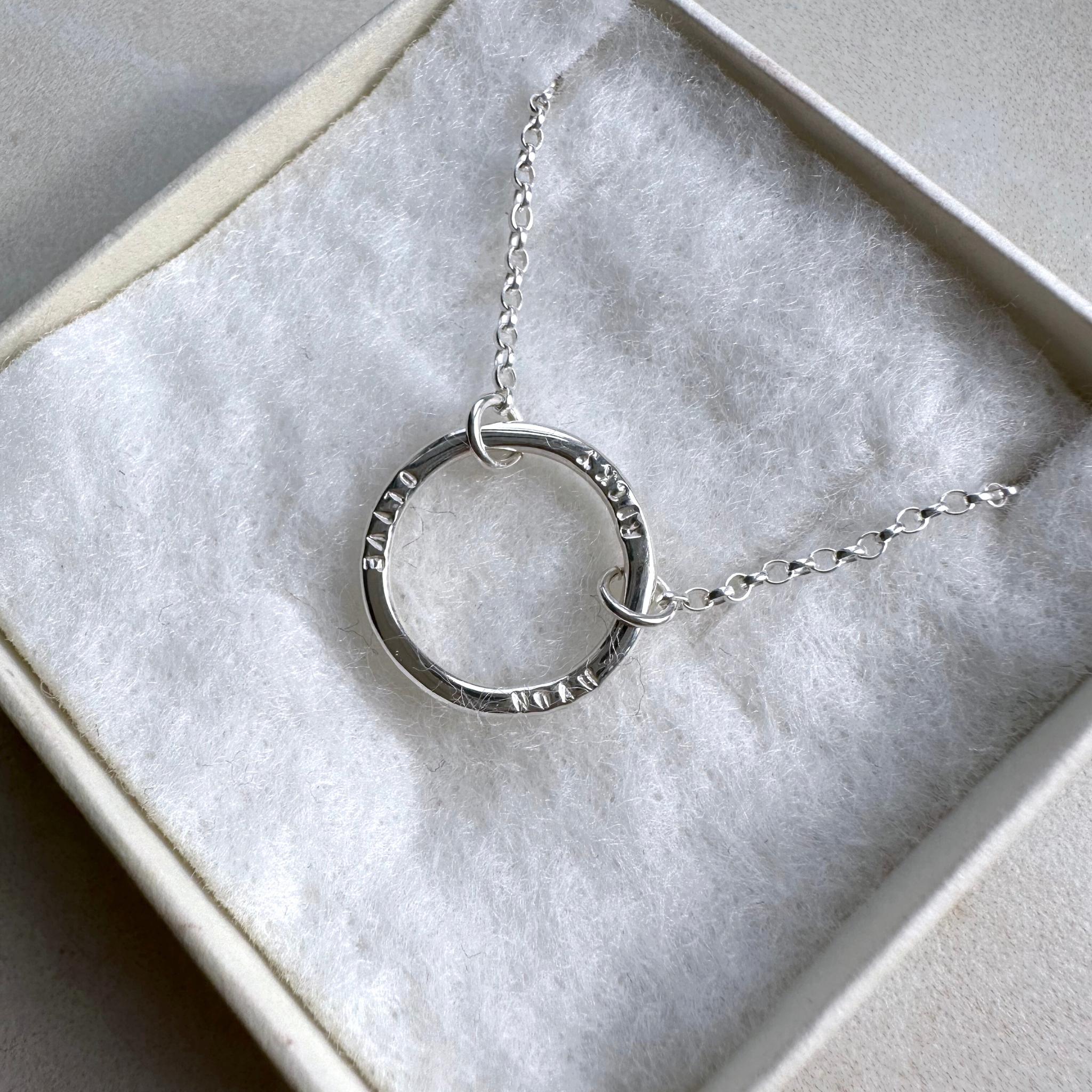 Single halo necklace in sterling silver in an aujune box