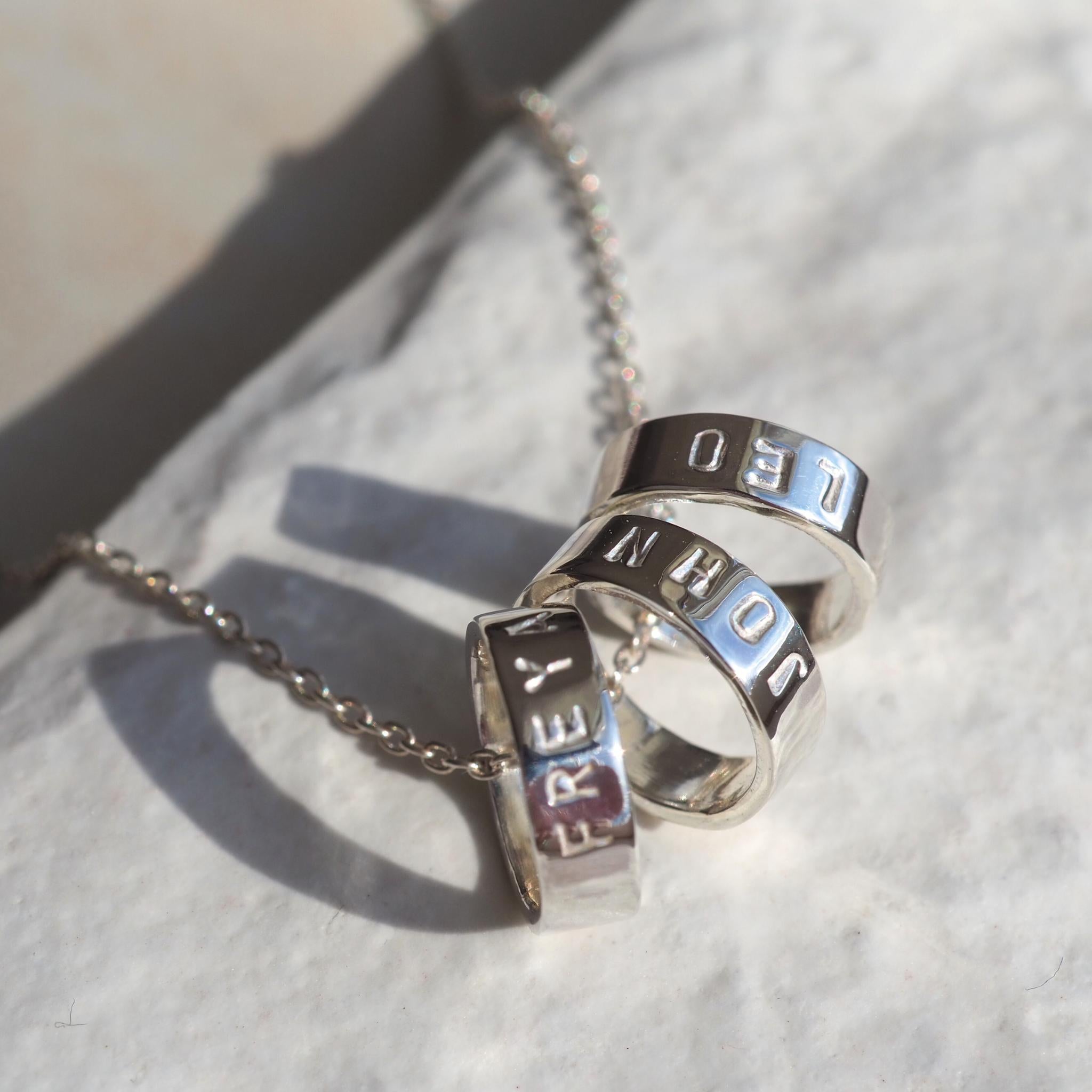 Custom scroll necklace in sterling silver, personalised with meaningful names 